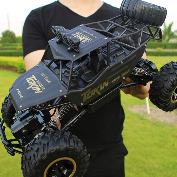 4WD Monster Truck with Dragon 2.4Ghz Remote Control: black, dark gray remote-control off-road buggy vehicle, rugged off-road