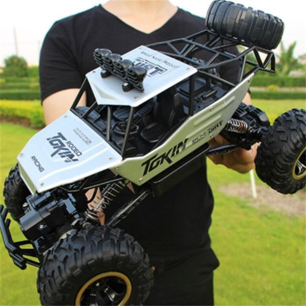 4WD Monster Truck with Dragon 2.4Ghz Remote Control: black, dark gray remote-control off-road buggy vehicle, rugged off-road