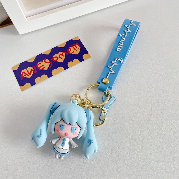 Adorable Miku Keychains with Pastel Charm: light blue, white anime-style girl character with long twin-tail blue hair, kawaii