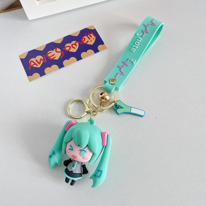Adorable Miku Keychains with Pastel Charm: light blue, white anime-style girl character with long twin-tail blue hair, kawaii