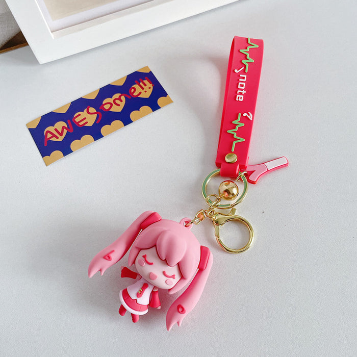 Adorable Miku Keychains with Pastel Charm: light blue, white anime-style girl character with long twin-tail blue hair, kawaii