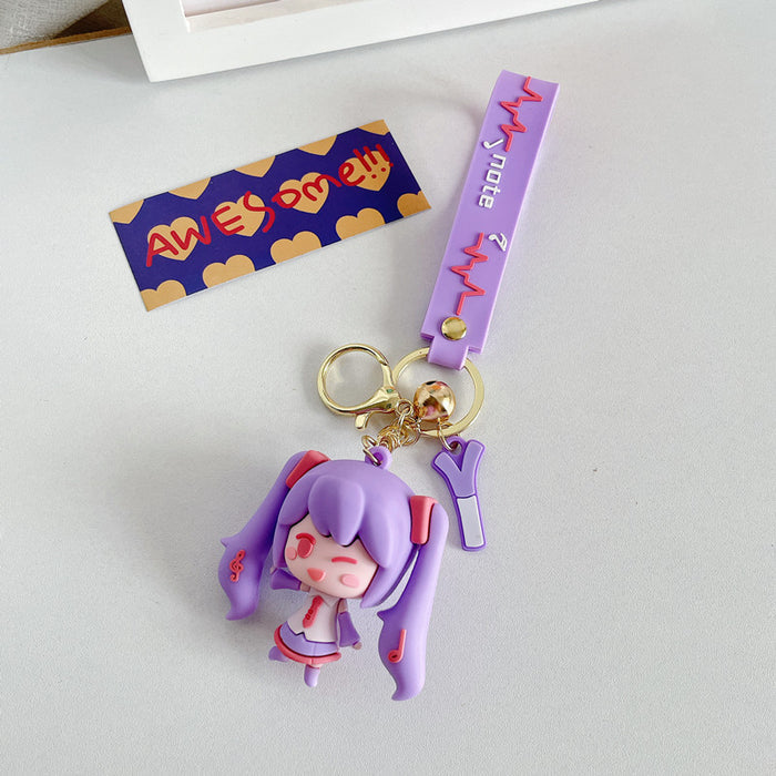 Adorable Miku Keychains with Pastel Charm: light blue, white anime-style girl character with long twin-tail blue hair, kawaii