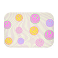 Bath Mat with Happy Faces: off-white, pale pink smiley face theme, playful cartoon style