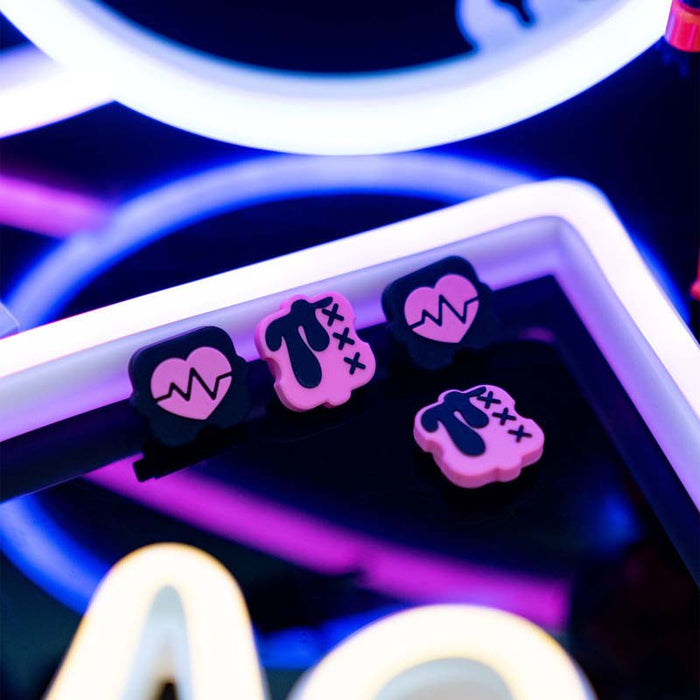 Black n Pink Switch Thumb Grips: turquoise blue, coral red cartoon bunny-like character graphic