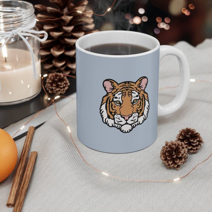 Blue Mug with Tiger Logo: light blue-gray, white tiger, cartoon style