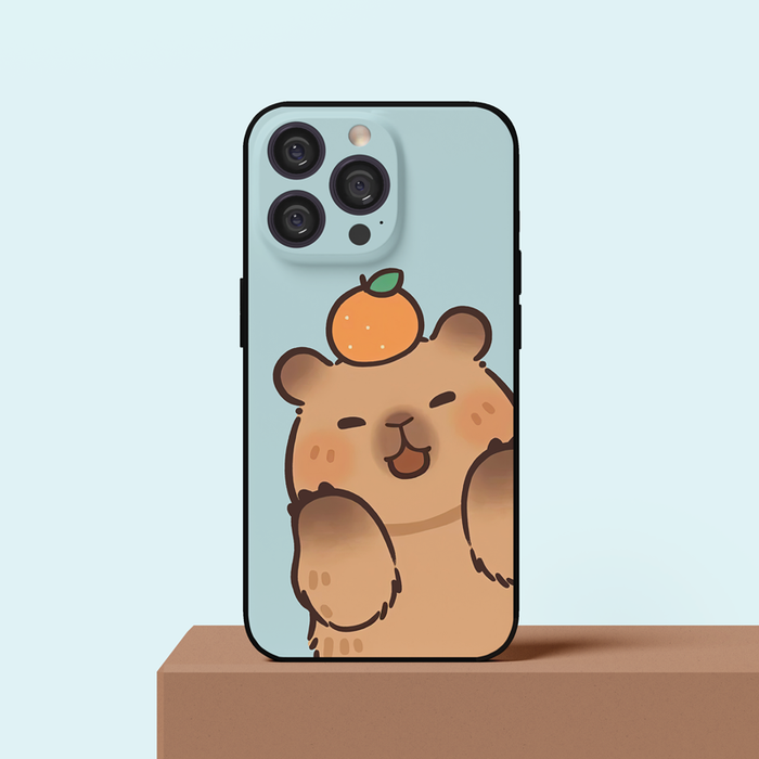 Capybara Phone Case for Smartphones: light blue, brown cartoon bear with an orange on its head, kawaii cartoon style
