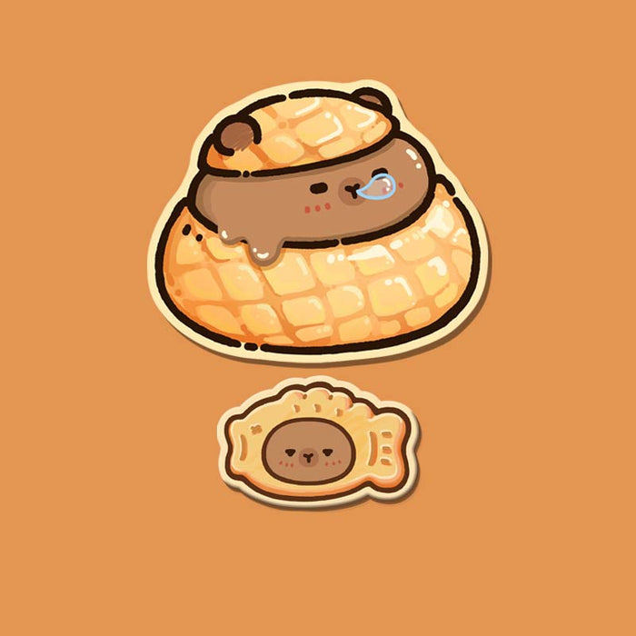 Capybara Wrist Rest + Mouse Pad: orange, tan cartoon capybara in a pastry-like nest with a smaller capybara-face cookie below