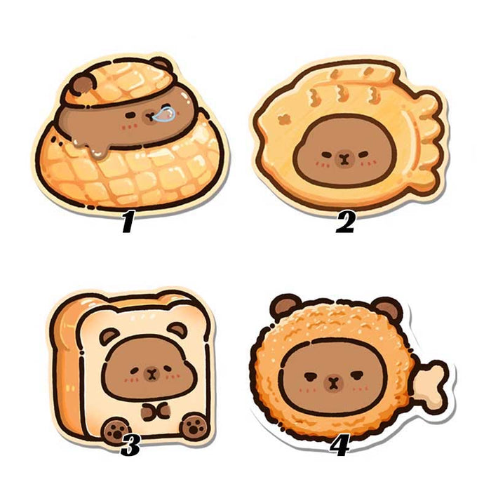 Capybara Wrist Rest + Mouse Pad: orange, tan cartoon capybara in a pastry-like nest with a smaller capybara-face cookie below