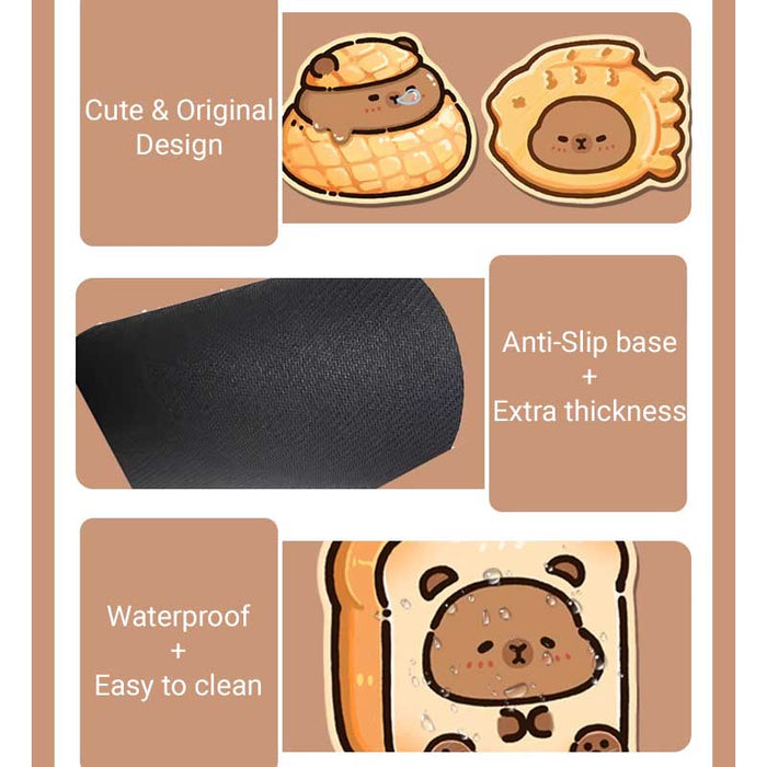 Capybara Wrist Rest + Mouse Pad: orange, tan cartoon capybara in a pastry-like nest with a smaller capybara-face cookie below