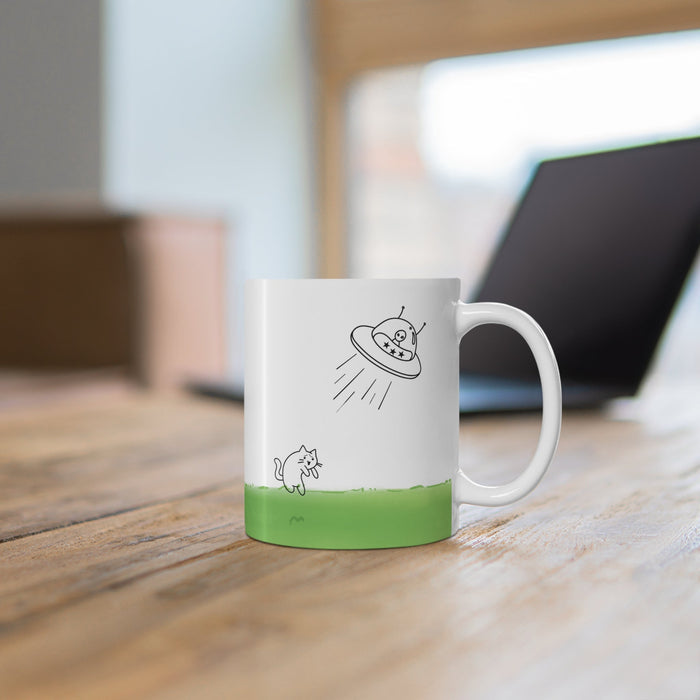 Cat Mug Taken by UFO: white, green cartoon cat and alien in a UFO, minimal cartoon style