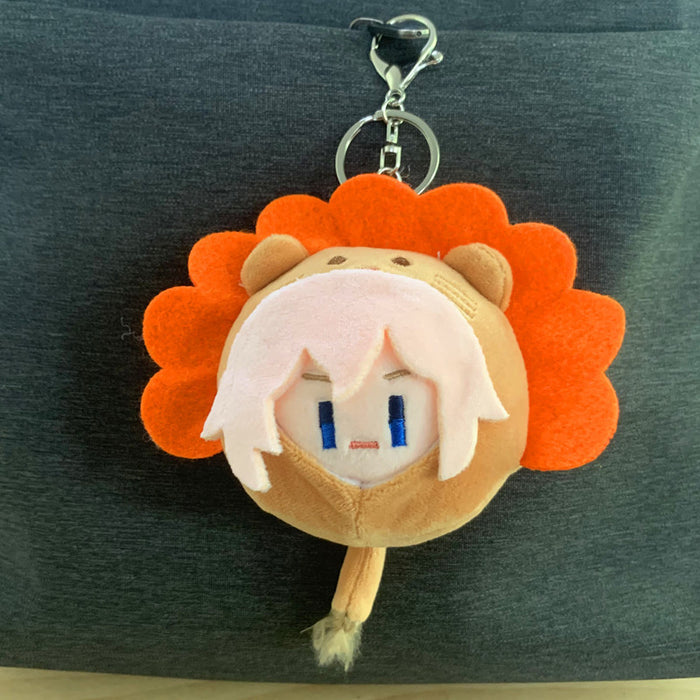 Chibi Genshin Impact Plush Keychain: blue, blond/yellow cartoon blond-haired character, kawaii cartoon style
