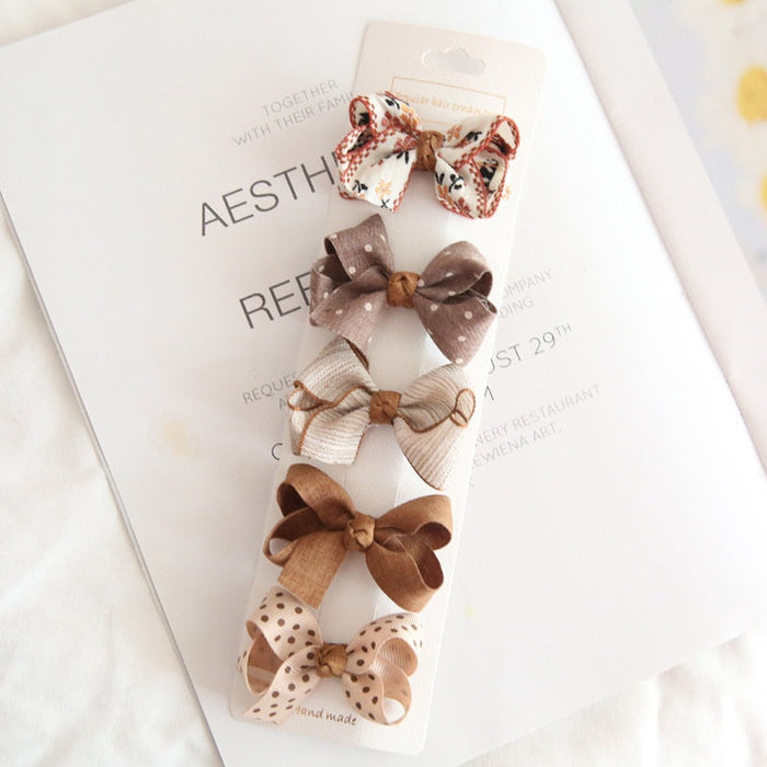 Chic Hair Bow Pins in Neutral Tones: beige, brown hair accessory set on display cards, cute, soft neutral, vintage-inspired s