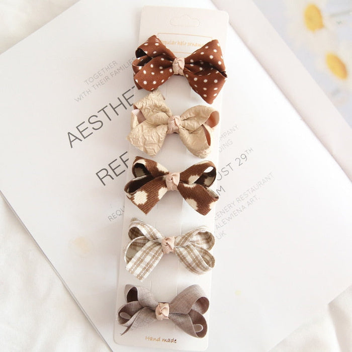 Chic Hair Bow Pins in Neutral Tones: beige, brown hair accessory set on display cards, cute, soft neutral, vintage-inspired s