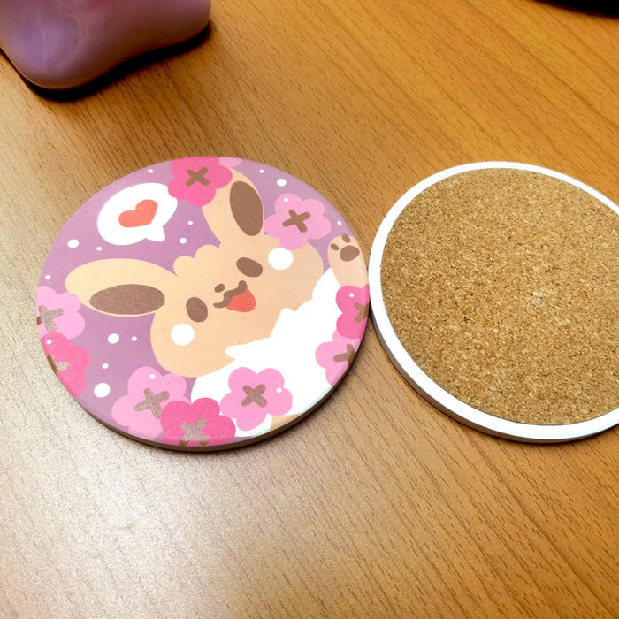 Cute Coasters with Chibi Pokemon design: pink, purple cartoon bunny character with flowers and heart, kawaii cartoon style