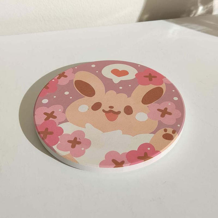 Cute Coasters with Chibi Pokemon design: pink, purple cartoon bunny character with flowers and heart, kawaii cartoon style