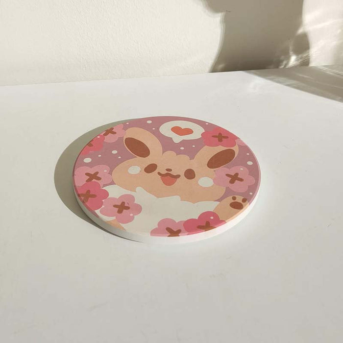Cute Coasters with Chibi Pokemon design: pink, purple cartoon bunny character with flowers and heart, kawaii cartoon style