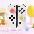Cute Glittering Slime Joystick Caps: white, black pair of game controller grips/controllers, cute, colorful gaming accessory