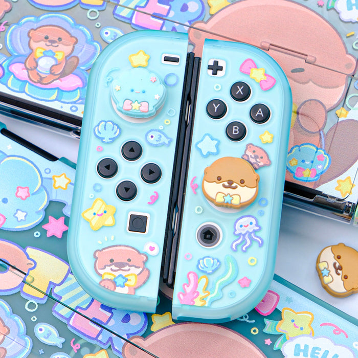 Cute Otter Switch Thumb Grips, Compatible: light blue, pink cute animal characters and sea-themed icons, kawaii cartoon style