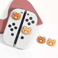 Cute Red Panda Joystick Caps for Switch: orange, brown cartoon bear face, kawaii cartoon style
