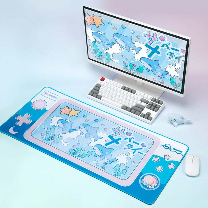 Cute Shark Gaming Desk Mat with Ocean Vibes: cyan blue, white cartoon sharks and sea-themed characters, kawaii cartoon style