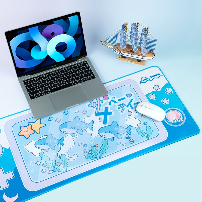 Cute Shark Gaming Desk Mat with Ocean Vibes: cyan blue, white cartoon sharks and sea-themed characters, kawaii cartoon style