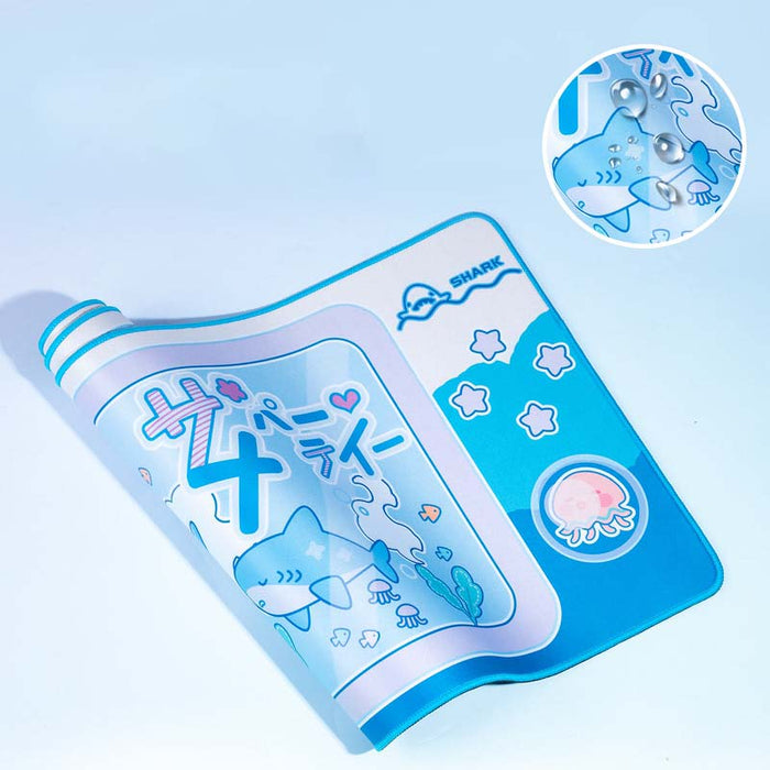 Cute Shark Gaming Desk Mat with Ocean Vibes: cyan blue, white cartoon sharks and sea-themed characters, kawaii cartoon style