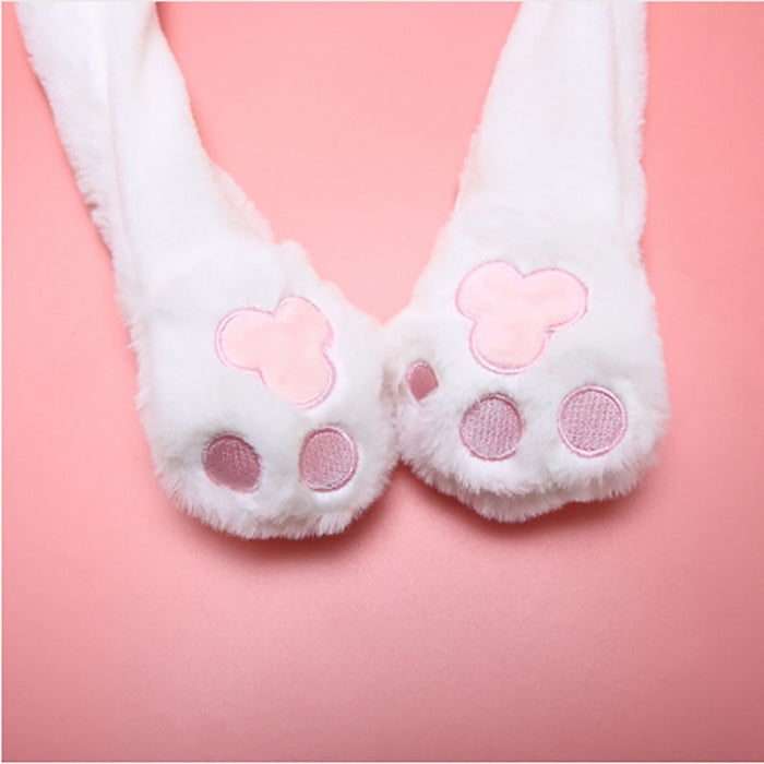 Dancing Bunny Hat with Moving Ears: white, light beige bear wearing a bunny hat, kawaii cartoon style