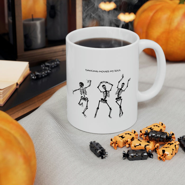 Dancing Skeletons Mug: white, black three dancing skeleton characters, cartoon graphic style