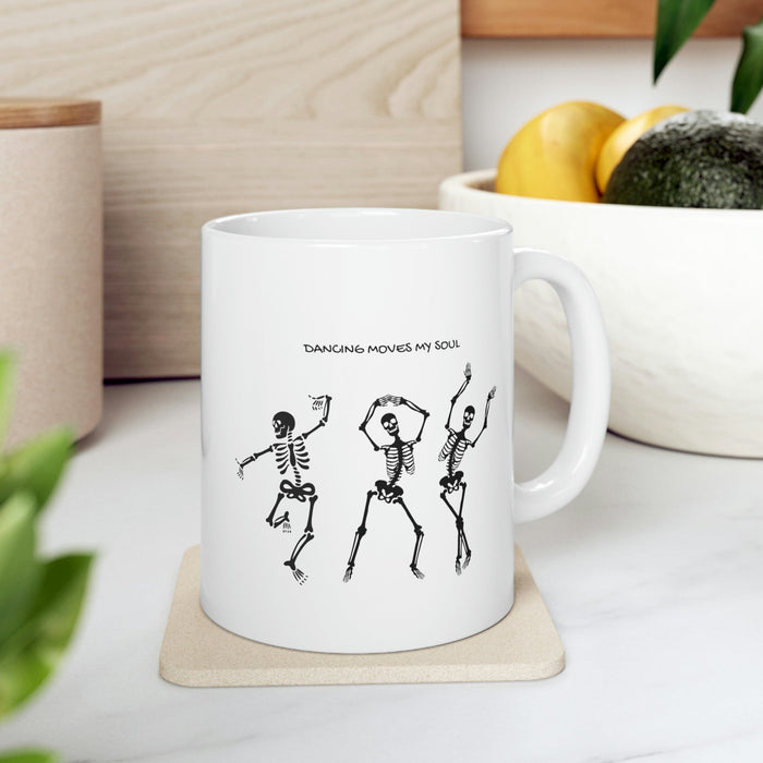 Dancing Skeletons Mug: white, black three dancing skeleton characters, cartoon graphic style