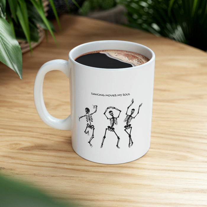 Dancing Skeletons Mug: white, black three dancing skeleton characters, cartoon graphic style
