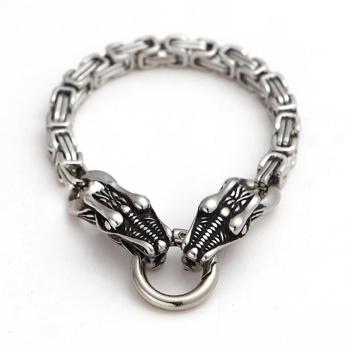 Double Bracelet with Twin Wolf Heads: silver, dark gray accents two wolf heads, animal-themed, bold style
