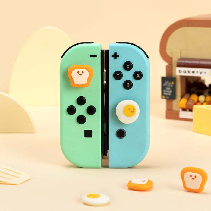 Egg x Toast Switch OLED Joystick Caps: mint green, light blue toast and fried egg character theme, kawaii cartoon style