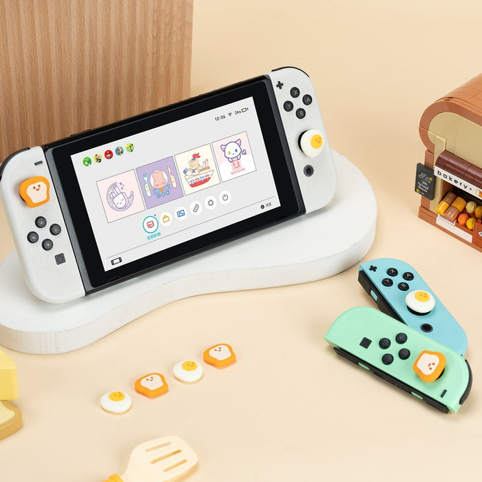 Egg x Toast Switch OLED Joystick Caps: mint green, light blue toast and fried egg character theme, kawaii cartoon style