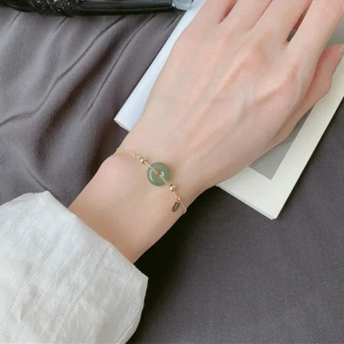 Fashion Bracelet with Charming Jade Design: gold, muted green bracelet, minimal style