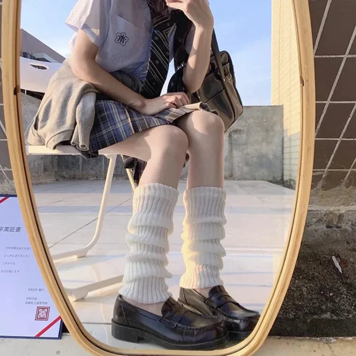 Feminine Leg Cozies: black, white striped knee-high socks, playful style