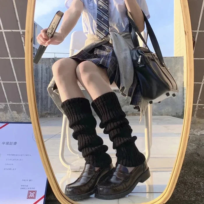 Feminine Leg Cozies: black, white striped knee-high socks, playful style