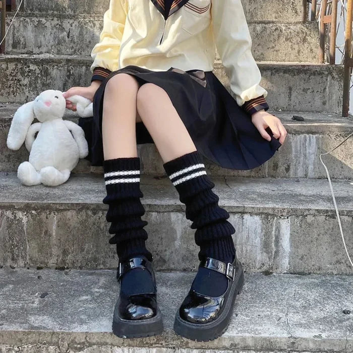 Feminine Leg Cozies: black, white striped knee-high socks, playful style