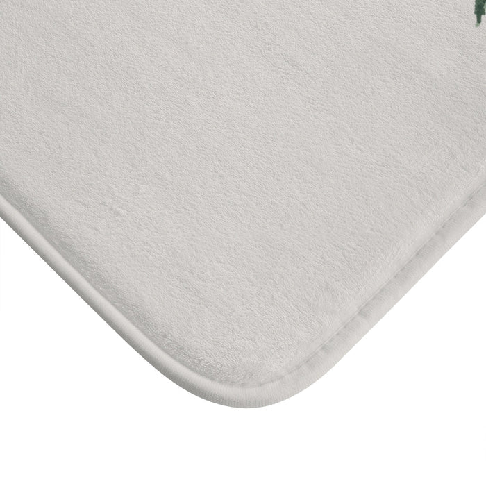 Forest Dweller Gnome Home Accents Bath Mat: off-white, dark green evergreen trees and a small gnome, illustrated woodland sty