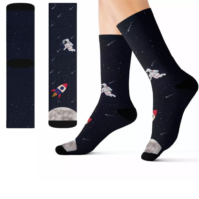 Funny Novelty Socks for Space Enthusiasts: dark navy, black space theme with astronauts and rocket, cartoon space-themed styl
