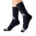 Funny Novelty Socks for Space Enthusiasts: dark navy, black space theme with astronauts and rocket, cartoon space-themed styl