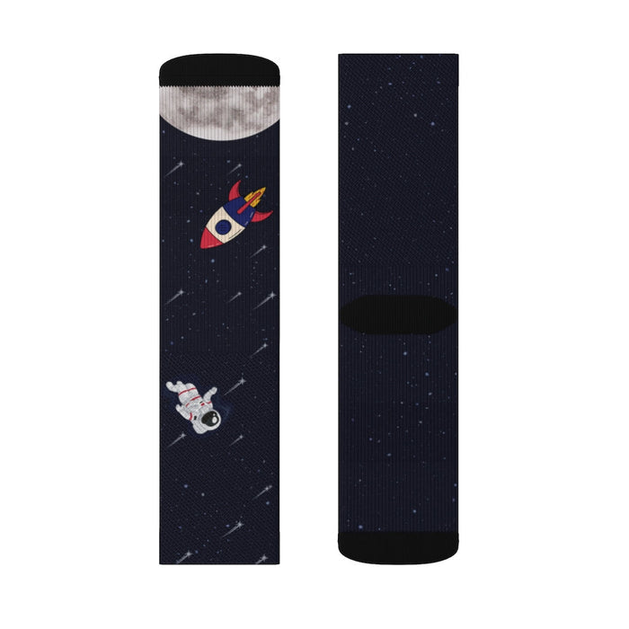 Funny Novelty Socks for Space Enthusiasts: dark navy, black space theme with astronauts and rocket, cartoon space-themed styl