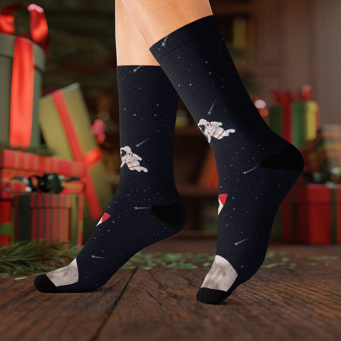 Funny Novelty Socks for Space Enthusiasts: dark navy, black space theme with astronauts and rocket, cartoon space-themed styl