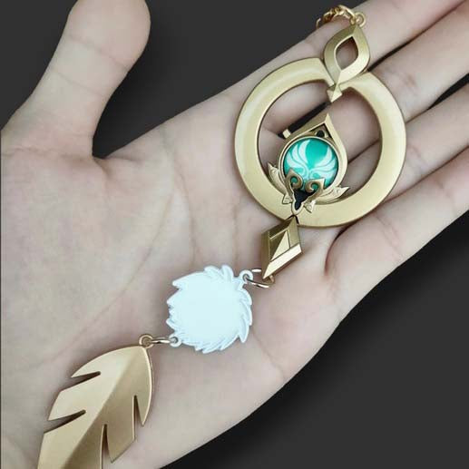 Genshin Impact Scaramouche Keychain: Glowing Vision: gold, turquoise ornamental feather motif, ornamental fantasy style