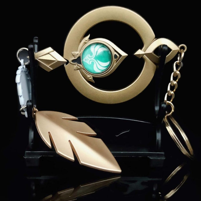 Genshin Impact Scaramouche Keychain: Glowing Vision: gold, turquoise ornamental feather motif, ornamental fantasy style
