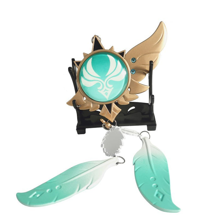 Genshin Impact Venti Vision Keychain: glowing turquoise green, brown fantasy winged emblem with feather charms, fantasy carto