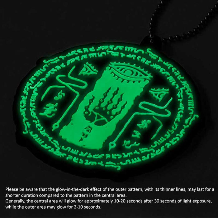 Glow in the Dark Zelda Keychains: black, mint green stylized mystical eye and hand symbol, graphic, occult-inspired, cartoon