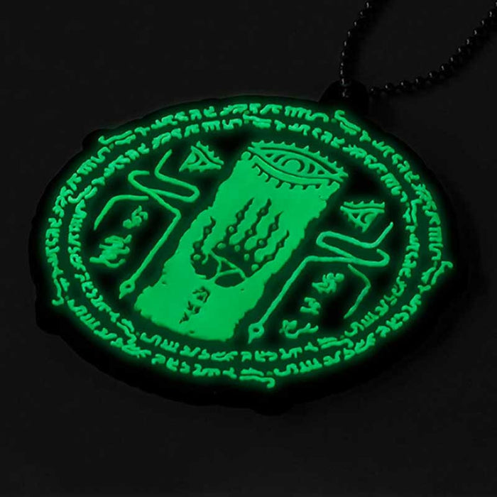 Glow in the Dark Zelda Keychains: black, mint green stylized mystical eye and hand symbol, graphic, occult-inspired, cartoon