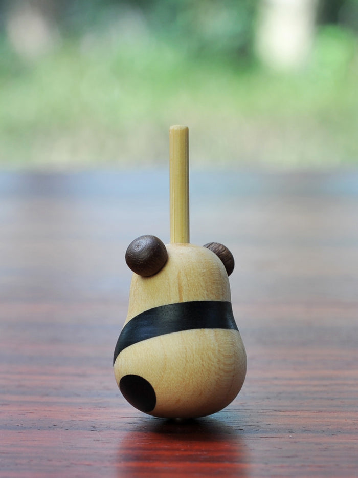 Handcrafted Wood Panda Top with Base: light natural wood, dark brown panda, minimal cartoon style