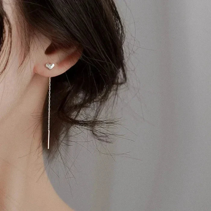 Heart-Shaped Earrings with a Delicate Dangling Design: silver heart, minimal style