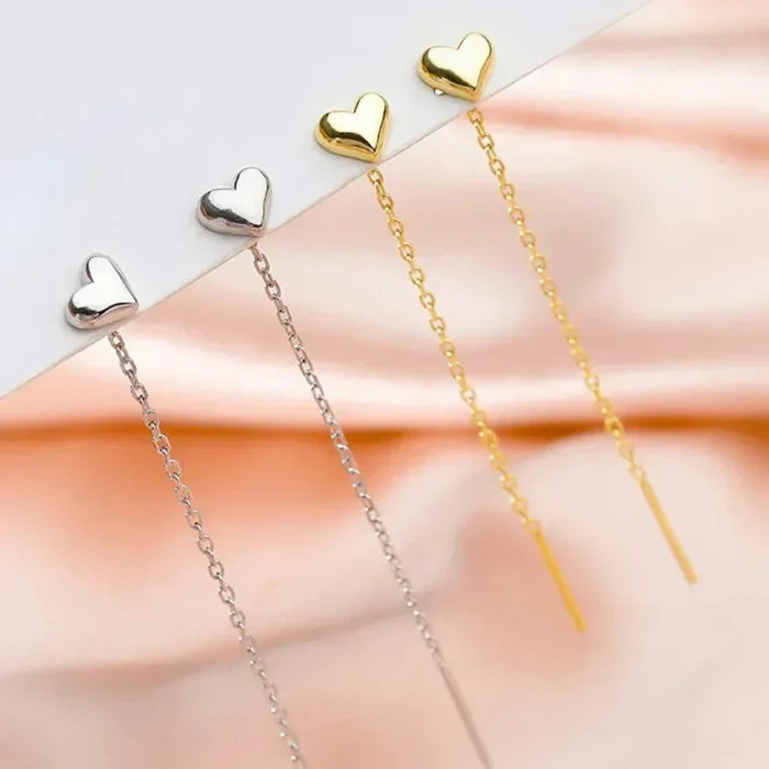 Heart-Shaped Earrings with a Delicate Dangling Design: silver heart, minimal style
